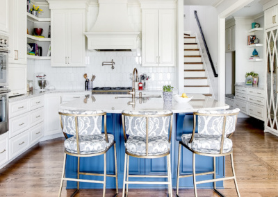 modern white kitchen blue island stools double oven white backsplash
