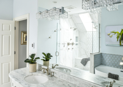 white bathroom freestanding tub marble countertop satin finishes frameless shower door tile tub surround